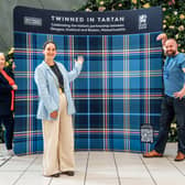 (L-E) Kathy Murdoch, Buchanan Galleries Centre director, Ballie Christy Mearns, deputy lord provost of Glasgow and Steven Caldwell, Slanj Kilts, at unveiling of a bespoke tartan in Glasgow, to celebrate the friendship between Boston and Glasgow, following the Tartan Army takeover of the World Cup host city during this year's tournament.