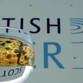 Scottish Water logo pictured through a glass of water