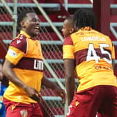 Motherwell's Ibrahim Said (L) celebrates with Emmanuel Longelo (45) and Tawanda Maswanhise after scoring to make it 2-0 during a UEFA Europa Conference League Third Qualifying Round Second Leg match between Motherwell and HJK Helsinki 