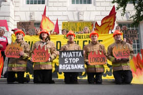 Campaigners from Fossil Free London, Christian Climate Action and the Climate Choir take part in a protest against plans for drilling in the Rosebank oil field, outside the Department For Energy Security And Net Zero (DESNZ) in Westminster, central London