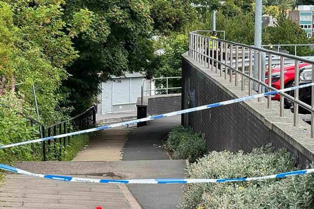 A section of the pavement has been taped off as police scour the scene.