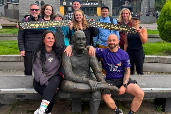 Benjamin Ward (front right), 44, alongside his partner Natasha Goldthorpe (front left) and friends, after completing his latest West Highland Way challenge