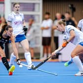 Scotland, in white, defended solidly against Argentina but eventually lost the Hockey World Cup Pool B match 2-0 in Belgium.