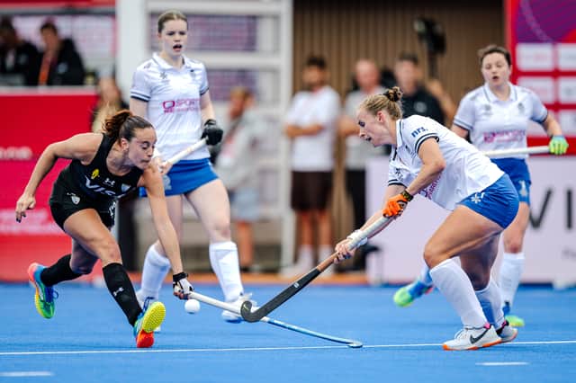 Scotland, in white, defended solidly against Argentina but eventually lost the Hockey World Cup Pool B match 2-0 in Belgium.