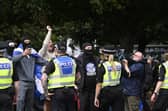 Protesters run from police during an anti-immigration protest in Glasgow in July.  Picture: PA