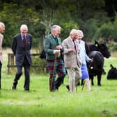 (L to R) Crispian Cook, Oliver Russell, Matthew Currie, HM King, Claire Russell, and David Johnstone