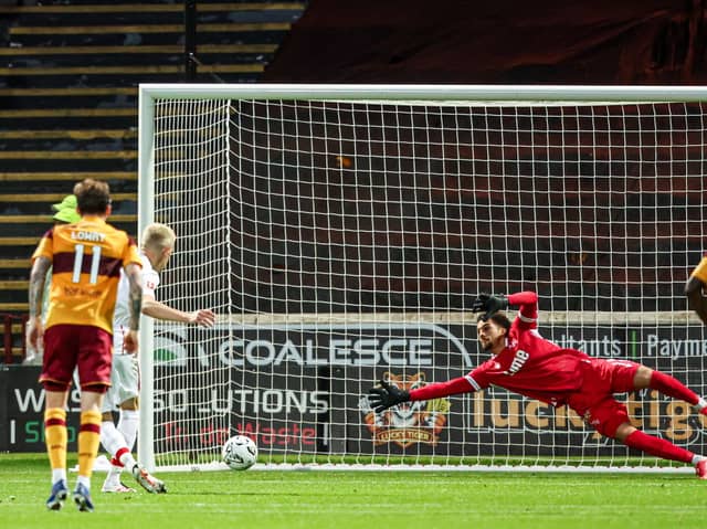 Freiburg's Matthias Ginter scores from the penalty spot to make it 2-1 during a UEFA Conference League Playoff Round First Leg match between Motherwell and Freiburg