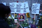 Tributes left after a vigil, organised by campaign group Stand Up to Racism, for Professor Jason Arday