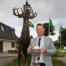 Gareth Hardy, the head PGA pro at Prestwick St Nicholas, shows off the trophy after winning the Deer Park Masters