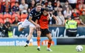 Dundee United's Dylan Tait (R) and Dundee's Ethan Hamilton in action