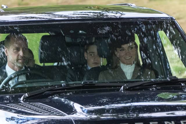 The Prince and Princess of Wales and their son Prince George and daughter Princess Charlotte (left obscured) arrive to attend a Sunday church service at Crathie Kirk, near Balmoral