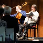 Ali Smith on stage with musicians from the New European Ensemble during a performance of Seasonal Quartet 