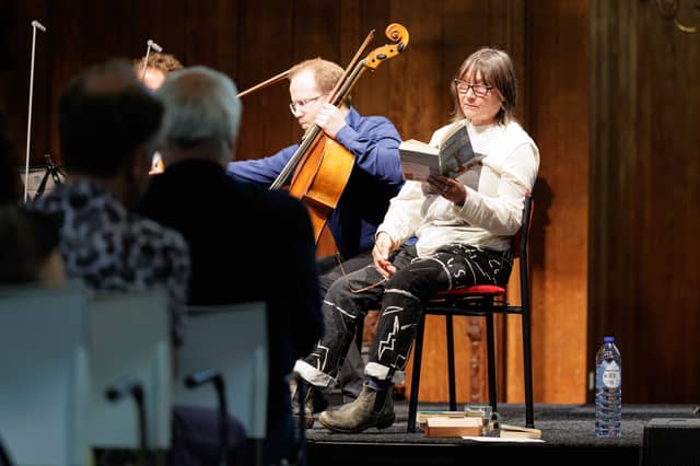 Ali Smith on stage with musicians from the New European Ensemble during a performance of Seasonal Quartet