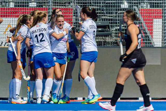 Scotland players celebrate Fiona Burnet's goal in the 2-1 victory over New Zealand at the Hockey World Cup in Belgium.