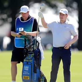 Bob MacIntyre selects a club from his bag during the first round of last week’s BMW Championship at Bellerive Country Club in St Louis