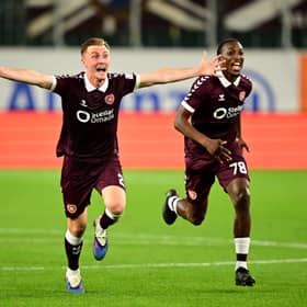 Christian Borchgrevink and Laurent Mendy of Heart of Midlothian celebrate after the penalty shootout victory in the UEFA Conference League 2026/27 Play Off Round Second Leg match against SK Rapid at Weststadion on August 26, 2026 in Vienna, Austria.  