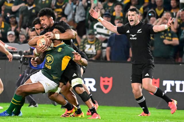 Sacha Feinberg-Mngomezulu of South Africa is tackled during the Rugby's Greatest Rivalry tour against New Zealand at Ellis Park on August 22, 2026 in Johannesburg.