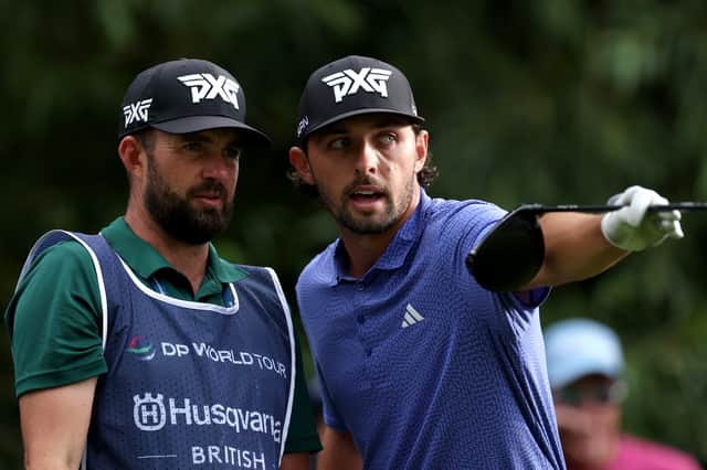 Marco Penge talks tactics with his caddie during the Husqvarna British Masters hosted by Sir Nick Faldo at The Belfry in Sutton Coldfield 