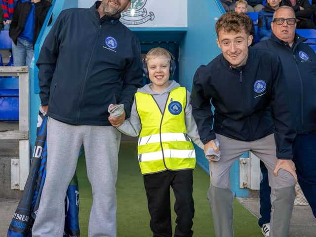 Jacob McDonald, 10, of Dundee, who is walking round every professional football ground in Scotland in memory of his late mother for charity