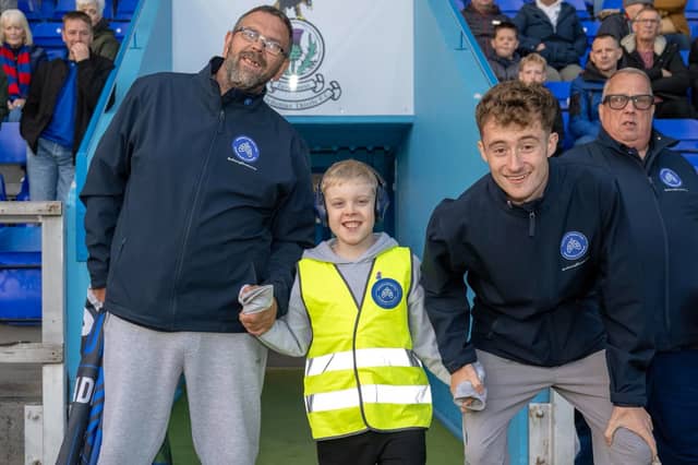 Jacob McDonald, 10, of Dundee, who is walking round every professional football ground in Scotland in memory of his late mother for charity