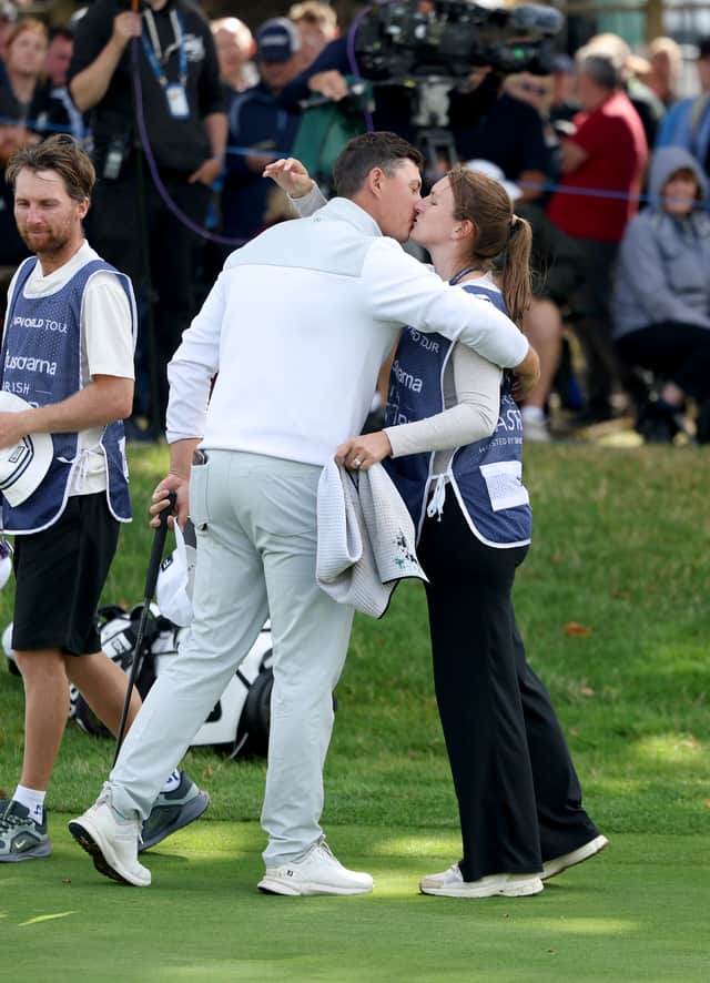 Joe Dean kisses his wife and caddie Emily after producing a brilliant final round to clinch his maiden DP World Tour win