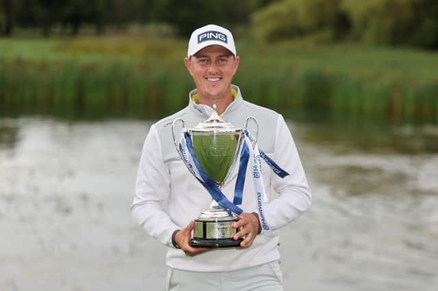 Joe Dean shows off his trophy after winning at The Belfry.