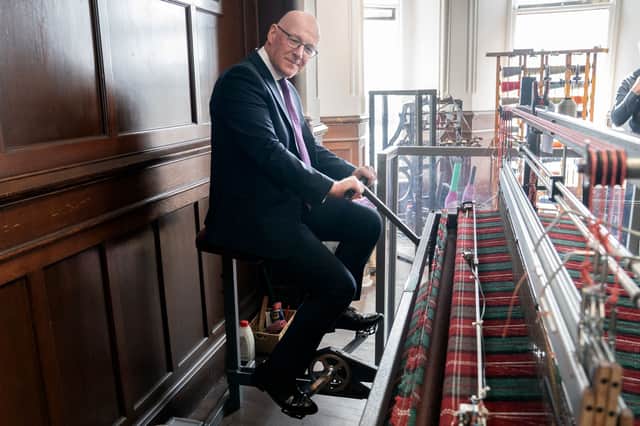 John Swinney tried a loom at the Harris Tweed Authority in Stornoway in April during a pre-election visit to Lewis (Picture: Jane Barlow)