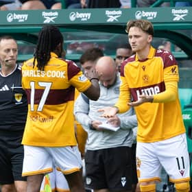 Motherwell's Alex Lowry (R) comes on for Regan Charles-Cook during a William Hill Premiership match between Hibernian and Motherwell
