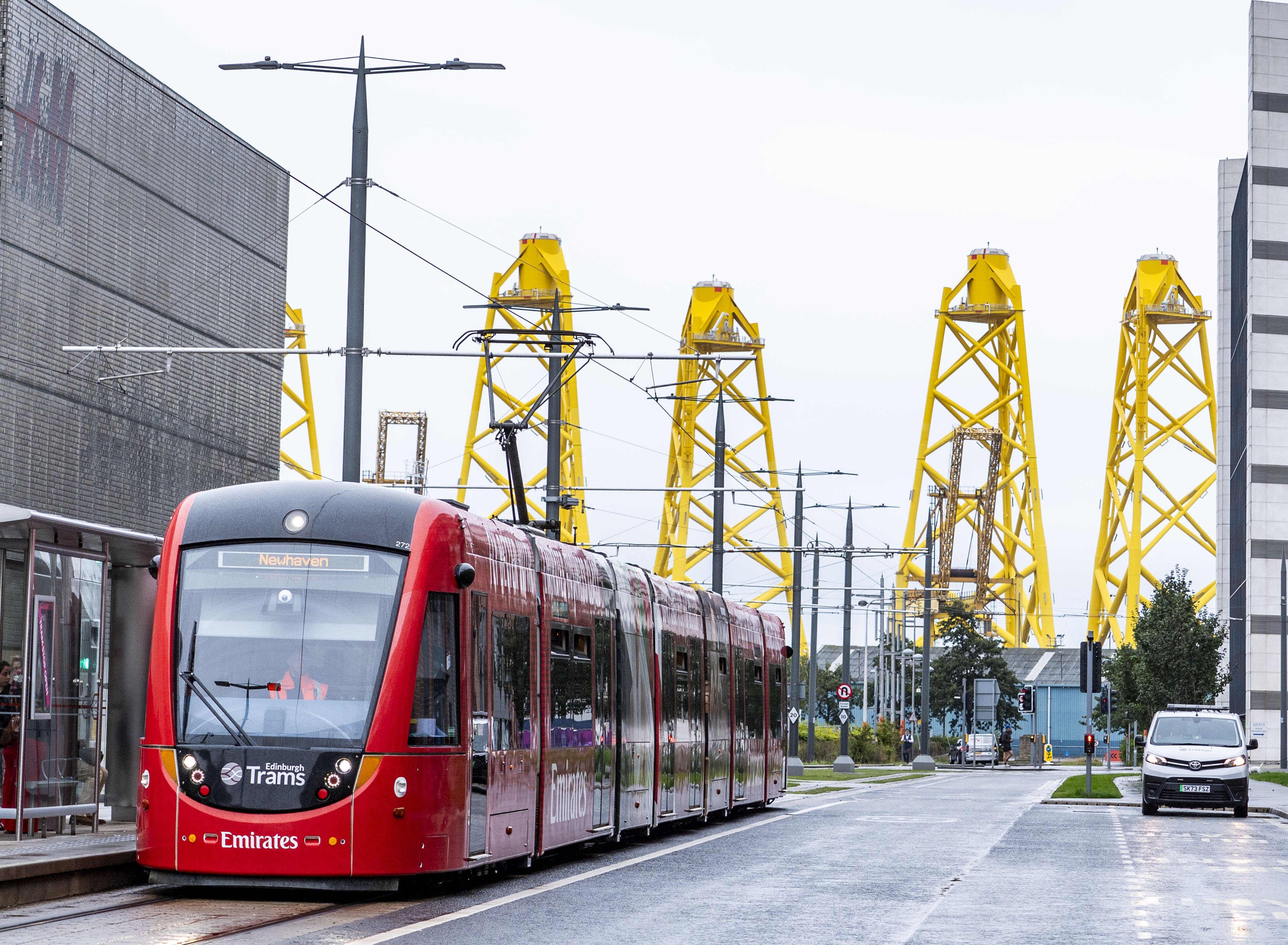 The giant yellow structures visible at the Port of Leith are massive steel foundations and transition pieces for the Inch Cape Offshore Wind Farm