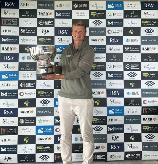 Will Porter shows off the trophy after winning the Fairmont St Andrews Classic presented by 5Star Sports Agency
