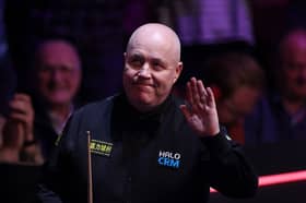 Scotland's John Higgins is in second round action today.