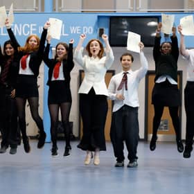 Education Secretary Mairi McAllan, centre, celebrates with students as they receive their exam results at Broughton High School (Picture: Jeff J Mitchell)
