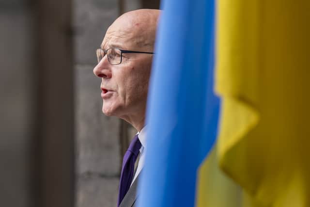 John Swinney outside the City Chambers in Edinburgh, during a ceremony to mark the Independence Day of Ukraine in 2024