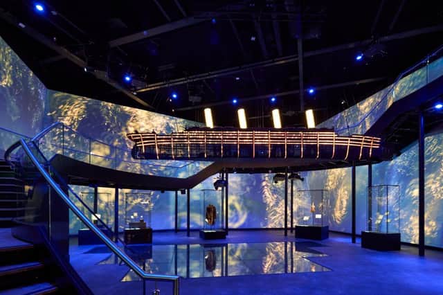 Inside Titanic Belfast's atmospheric Ship of Dreams gallery, where dramatic displays and artefacts bring the story of the legendary liner to life.