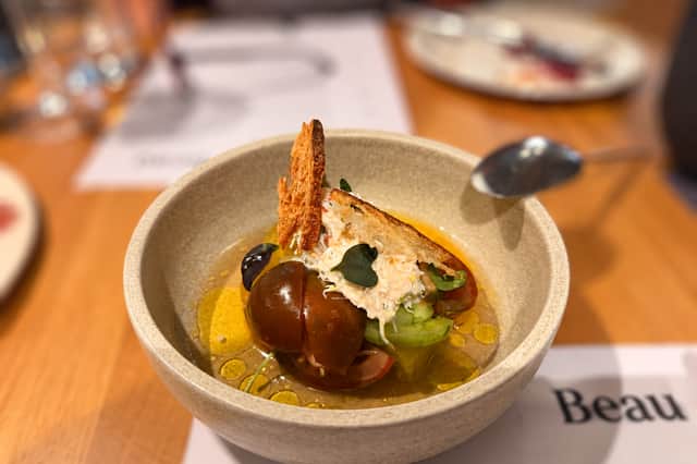 Kilkeel Crab with Heirloom Tomato Consommé at Beau in Belfast, pairing delicate crab with a clear, vibrant tomato essence.
