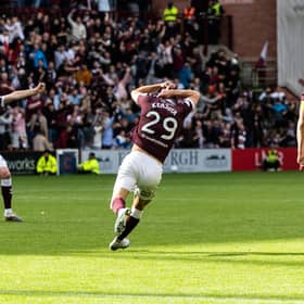 Hearts' Sabah Kerjota (c) celebrates after scoring a stoppage time win over Dundee at Tynecastle.