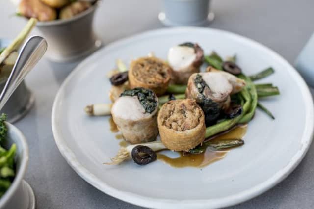 Rabbit with spring onion, confit garlic and olives.