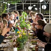Diners enjoy the wonders of the Herb Garden under the light of the full moon.