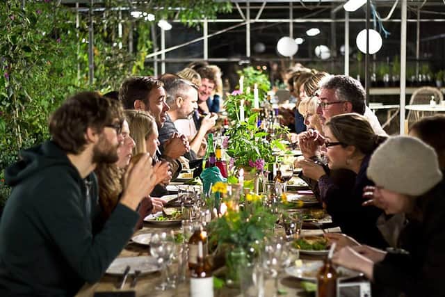 Diners enjoy the wonders of the Herb Garden under the light of the full moon.