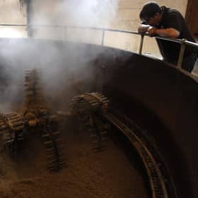 A Bruichladdich worker watches over a mash tun. Picture: Ian Rutherford