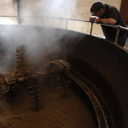 A Bruichladdich worker watches over a mash tun. Picture: Ian Rutherford