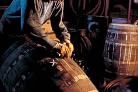 A Glenfiddich cooper hard at work. Picture: William Grant & Sons