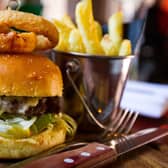 ABBQ BBQ beef burger with Monterey jack cheese, salad, sauce and pickle