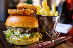 ABBQ BBQ beef burger with Monterey jack cheese, salad, sauce and pickle