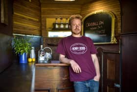 Walter Micklethwait is pictured with his Horse Box Bar on his estate near Aviemore, Scotland.  A man has built Scotland's smallest bar -- inside a dilapidated old horsebox.  See CENTRE PRESS story CPBOX.  Enterprising estate manager Walter Micklethwait, 37, was given the trailer by a friend and told to make it into a pub, which he duly did.  The bar, which he describes as a "Victorian old man's pub", can just about accommodate two members of staff, but has bar stools for customers on the front.  Walter is no stranger to making weird and wonderful creations out of old vehicles and buildings  earlier this year he won the prestigious shed of the year award for his gin distillery fashioned from an old hen house.  And having also won gin of the year for his Crossbill gin, made with berries harvested in the Highlands, he decided to make a bar to serve it in  which can be easily transported from place to place.