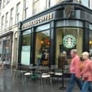 News 09/08/08 Starbucks on the Royal Mile in Edinburgh. Musical tour guide Graeme Pearson has complained about another tour setting up near his pitch after he battled similar complaints from other tours on the Royal Mile.
coffee shops
Edinburgh streets