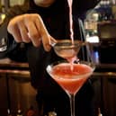 10/2/2004
FOR NEWS
BAR TENDER GRAHAM FORTUNE MIXES UP A FLIRTINI COCKTAIL IN THE ZINC BAR IN OCEAN TERMINAL. THE DRINK HAS BECOME VERY POPULAR, ESPECIALLY WITH THE LADIES, AFTER IT APPEARED IN THE HIT TV SHOW "SEX AND THE CITY"