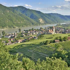 Wachau, Austria - June 17, 2015: Scenic View into the Wachau with the river Danube and the market town Weissenkirchen in Lower Austria. Famous UNESCO cultural landscape known for its wine.