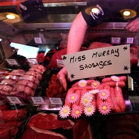 Butcher Connor Wilson from David Bennett and Son with his "Miss Murray Sausages"  in Andy Murray's home town of Dunblane. Picture: PA