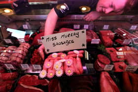 Butcher Connor Wilson from David Bennett and Son with his "Miss Murray Sausages"  in Andy Murray's home town of Dunblane. Picture: PA
